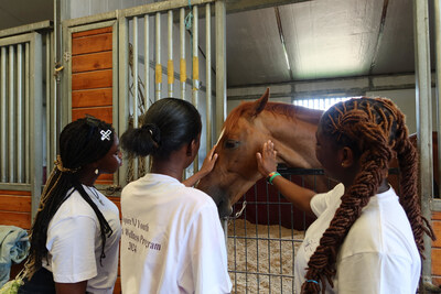 AspireNJ Youth Healing Hooves Participants interacting with Horse.