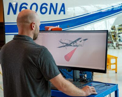 Mechanical Engineer Jeff Pollack finalizes his design for the integration of the laser communications terminal into the PC-12 research aircraft. Credit: NASA