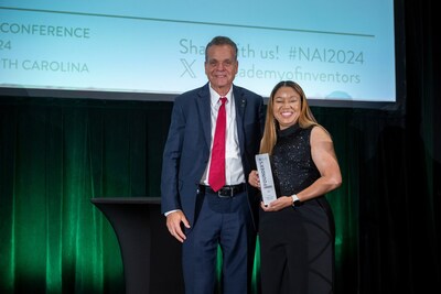 Dr. Almesha Campbell, Assistant Vice President of JSU’s Division of Research and Economic Development, accepts the NAI Award on behalf of JSU, Corporate Photography by Mark Skalny