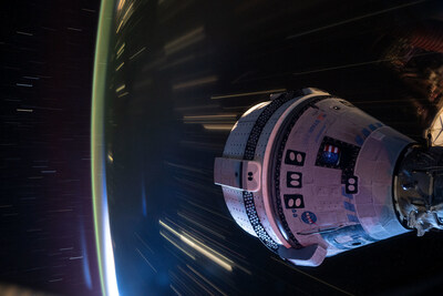 Boeing's Starliner spacecraft that launched NASA's Crew Flight Test astronauts Butch Wilmore and Suni Williams to the International Space Station is pictured docked to the Harmony module's forward port. This long-duration photograph was taken at night from the orbital complex as it soared 258 miles above western China. Credit: NASA