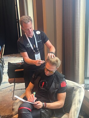 Stem cell banking only requires gently plucking some hairs from the scalp, as Dr. Bauman is doing here at the recent Biohacking Conference in Dallas with Dave Asprey, Founder of the Bulletproof brand and considered the "Father of biohacking",