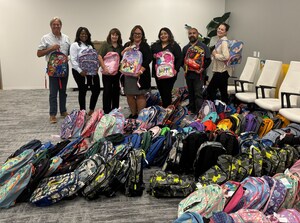 AMC Gives Back to Community Families with Backpack Drive