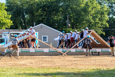 James Hardie CEO Aaron Erter and Pro Football Hall of Fame members help raise the walls of a new Habitat for Humanity home being built for the Shoup family in Canton, OH. James Hardie sponsored the construction of the home as part of the countdown to the inaugural James Hardie™ Pro Football Hall of Fame Invitational, a new PGA TOUR Champions event that will tee off in the spring of 2025, featuring the legends of golf and football, including Sapp, Barber, Munoz and Randle.