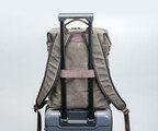 Wheeled suitcase passthrough attaches in the middle for extra stability.