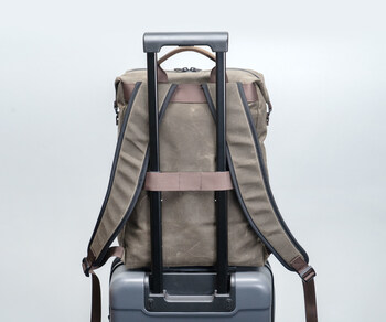 Wheeled suitcase passthrough attaches in the middle for extra stability.