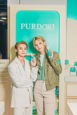 (Left to Right) Tiger and Jeremy from Cantopop boy band Mirror celebrate the opening of the Purdori enclave at Facesss Times Square Hong Kong.
