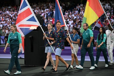 Britain's flag bearers Britain's gymnast Bryony Page (L) and Britain's Triathlon athlete Alex Yee (R) enter the stadium during the closing ceremony of the Paris 2024 Olympic Games at the Stade de France, in Saint-Denis, in the outskirts of Paris, on August 11, 2024. (Photo by Oli SCARFF / AFP) (Photo by OLI SCARFF/AFP via Getty Images) Courtesy of Ben Sherman