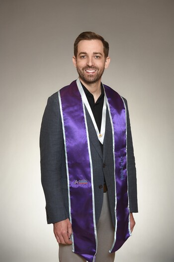 Dr. Gregory Feldman with his LLSR stole and ribbon