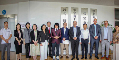 Prof. Dato' Sri Dr Mike Chan stands with delegates from the German Federal Association for Economic Development and Foreign Trade (BWA), City Officials of Baoding, and Sanzang Biotechnology delegates.