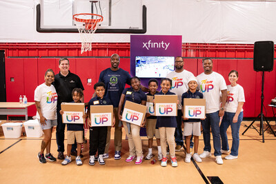 Students from the Boyce L. Ansley School in Atlanta receive laptops at a field day hosted by Comcast