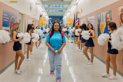 A student enters HEAL High School on the first day of school.