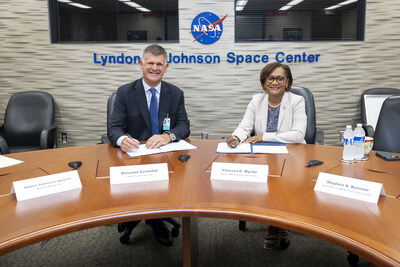 Giovanni Cristofoli, SVP of bp Solutions, and Vanessa Wyche, Director of NASA's Johnson Space Center, sign a Space Act Agreement between bp and NASA on Wednesday, August 7, 2024.