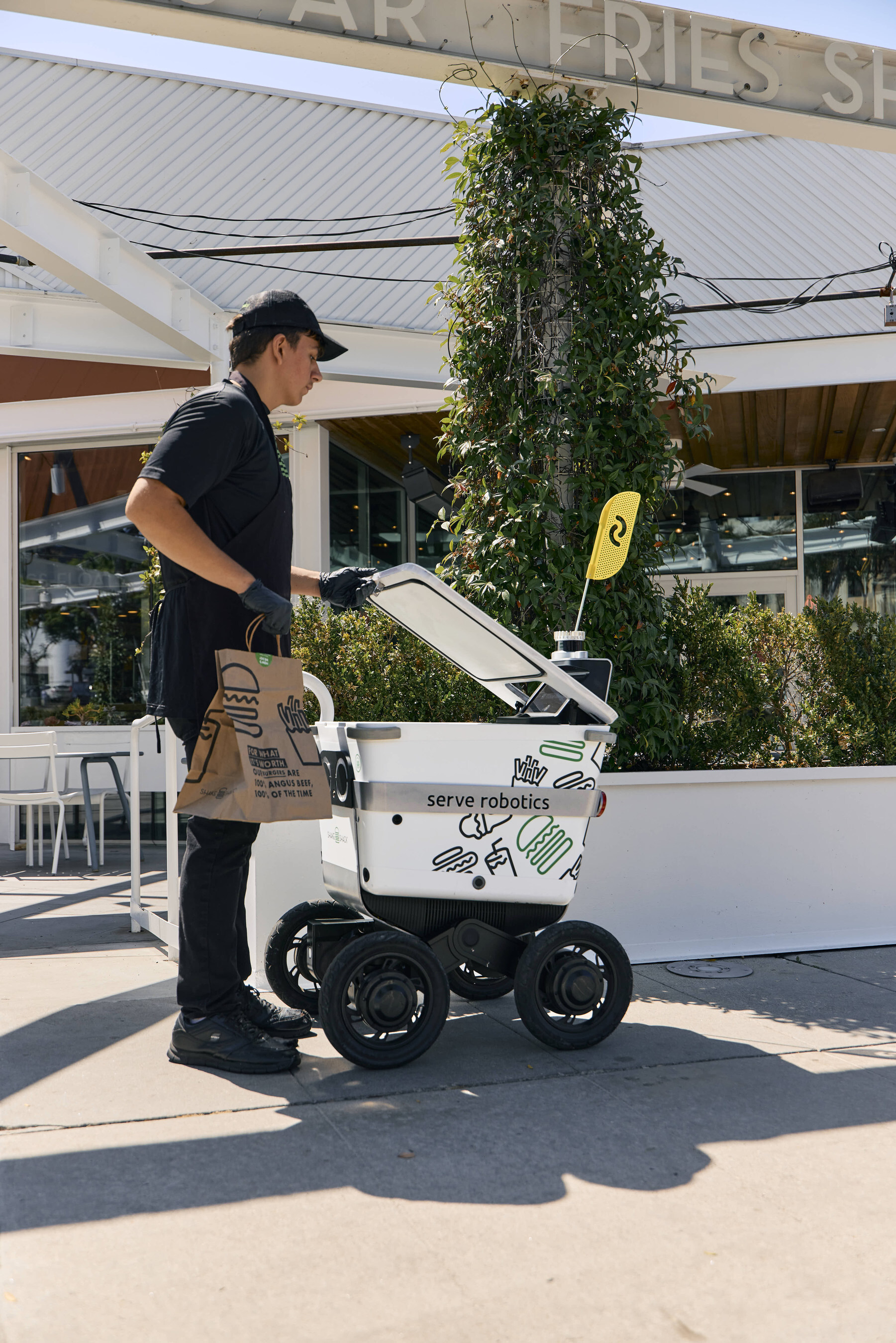 Serve Robotics delivery robot on delivery for Shake Shack