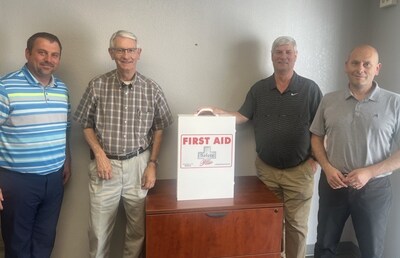 Pye-Barker's Ronnie Unruh, Ron Unruh and Jason Uhrich celebrate the partnership with Max Brown of Safety Plus.