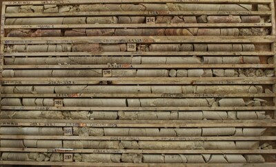 Figure 5 – Altered sandstone 17 to 35 metres above the unconformity in Target Area B                                         (LE24-165, 269.7-288.1m). The core is strongly bleached with intervals of desilicification, strong clay alteration (mostly in the lower six rows) and local secondary hematite (some of the hematite in rows two to four). Mineral spectroscopy classifies the clay as 100% illite. (CNW Group/IsoEnergy Ltd.)