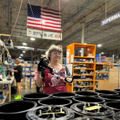 An employee at PLP's Rogers, Arkansas manufacturing facility assembles COYOTE® Dome Closures for shipment.