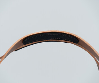 Long leather handles with hidden no-slip patches facilitate a hand or shoulder carry