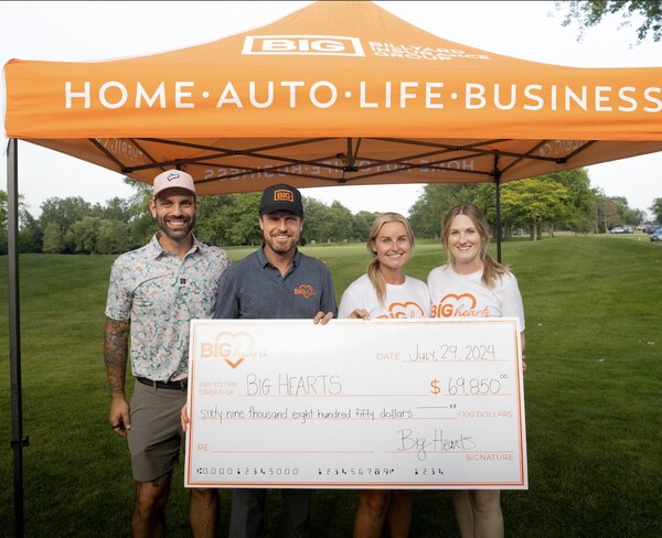 The BIG Hearts Foundation holding a cheque for $69,850 raised at the annual golf tournament.