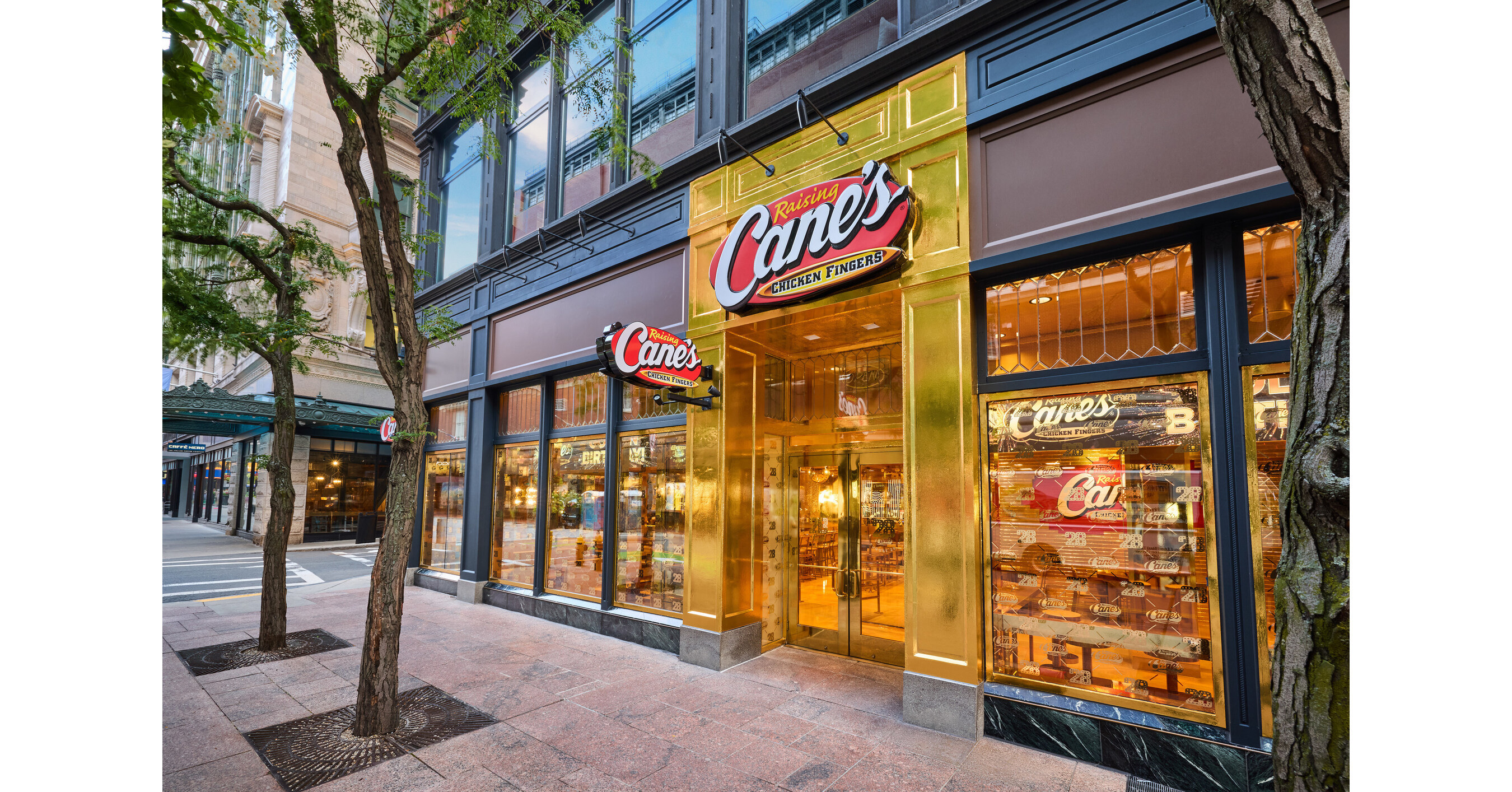 Boston greats David “Big Papi” Ortiz and Jrue Holiday as well as “Golden Hour” singer JVKE celebrate Raising Cane’s “Golden Birthday” with Todd Graves at the opening of a one-of-a-kind, all-gold Raising Cane’s restaurant in downtown Boston