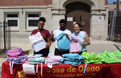 Jose de Diego Community Academy special education classroom assistants handed out backpacks donated by Katten to students at the school’s Back to School BBQ on August 23, 2024.