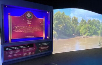 This bullet-ridden sign marked the spot Emmett Till's body was discovered.