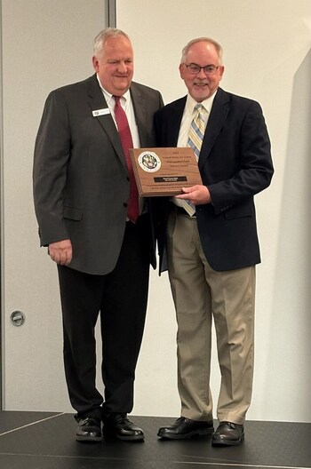 Tom McLean of Armed Forces Bank with Michael T. Windsor, Air Force Banking Manager.