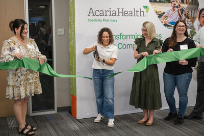 Jessica Ciccolella-Kahl, CEO of AcariaHealth, cuts the ribbon during the grand opening ceremony in Shelby Township, Michigan.