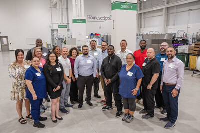 Members of AcariaHealth's Homescripts team gather in their new, upgraded dispensing pharmacy.