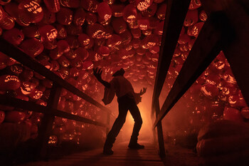 13th Gate: Werewolf with arms open to the key, standing on bridge, surrounded by Jack-o'-lantern Forest