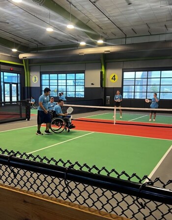 Chicken N Pickle Webster offers “pickleball for ALL,” with sports wheelchairs and “all abilities” programming.