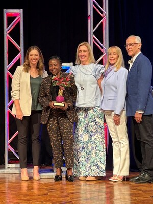 Leaders from the Greensboro Chamber as well as members of Kathi Lester's family were on hand to present the Kathiann Lester Award to Kim Reed, President and CEO of ITG Brands