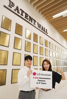 LG Innotek employees present the company's achievements in automotive component patents in front of the Patent Wall at LG Innotek's headquarters. The Patent Wall is a space dedicated to the display of plaques on major patents acquired by LG Innotek.