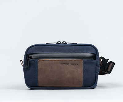 Shinjuku Sling for iPhone 16 in navy traditional waxed canvas + chocolate full-grain leather
