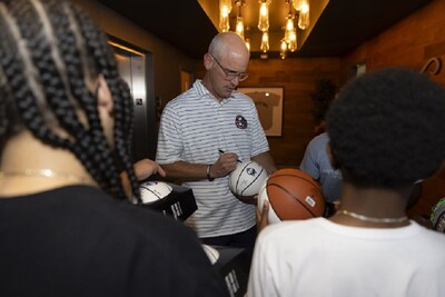 UConn Men’s Basketball Coach Dan Hurley signing a ball for a Boys & Girls Clubs of Hartford member.