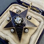 Antique 18k yellow gold and silver star pendant featuring a rich navy blue enamel and 6, buttercup set diamonds approximately 1.37ctw. Image courtesy of A Pocket of Rocks