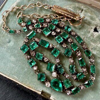 Antique, silver and 14K gold necklace featuring 34 emeralds totaling approximately 8.6 ct., and 33 diamonds totaling approximately 0.83 ct. Image courtesy of A Pocket of Rocks