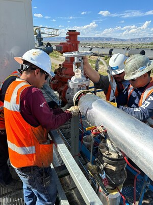 Kinley crews reinstalling heat trace and insulation after a valve replacement.