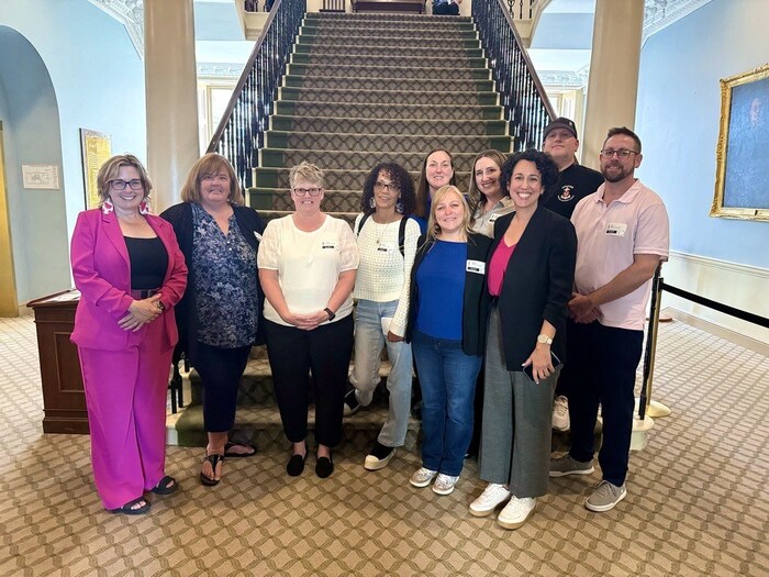 Unifor Atlantic Regional Director and NSNDP Leader Claudia Chender and MLA Susan LeBlanc stand with Unifor members and staff in the Nova Scotia Legislature. (CNW Group/Unifor)