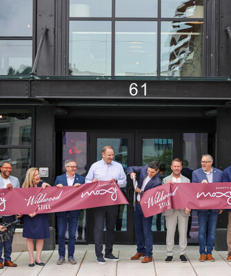 Project partners cut the ribbon, celebrating the grand opening of North Carolina's first Moxy hotel, Moxy Asheville.