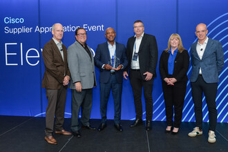 On behalf of Reconext, Michael Smith, Executive Vice-President of Sales & Marketing and Hugo Wentzel, Global Account Director accept the award for Excellence in Logistics at Cisco's Supplier Appreciation Event.