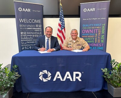 Frank Landrio, AAR’s Senior Vice President of Distribution, and Captain Dale Haney, Defense Logistics Agency Director of Maritime Operations, meet in Wood Dale, Illinois, for a signing ceremony.