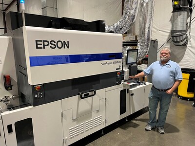 Glenn DeRossett, president of Husky Labels, with their Epson SurePress L-6534VW UV digital label press, selected for its high-speed capabilities, output quality, versatility, and reliability.