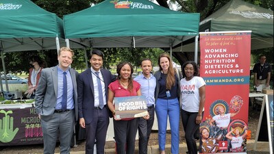 Team WANDA: Women Advancing Nutrition Dietetics and Agriculture (Tambra Raye Stevenson and Alliyah Vayson) with White House officials (Will McIntee and his colleagues) discussing the Food Bill of Rights at the USDA Farmer's Market in Washington, DC (Courtesy of WANDA; 2023).