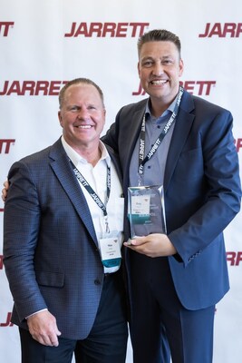 Mike Jarrett, President and CEO of Jarrett (left) is pictured with Gary Moore, CEO of HEXPOL, who accepted the award during the Jarrett Supply Chain Summit.