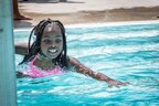 Swimmer wearing WAVE headset