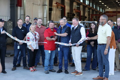 Members of BASEX leadership, Redmond city counselors, the Redmond Chamber, REDI, and community partner, Opportunity Foundation cut a ribbon in front of the new weld shop.