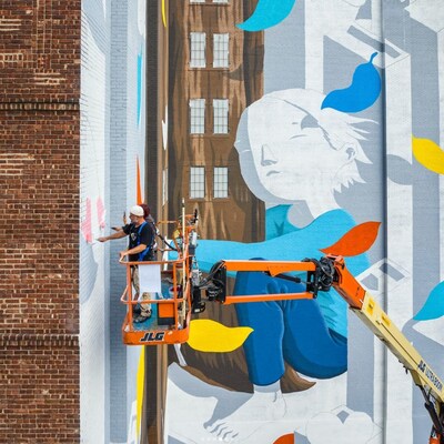 Artist Millo painted the large urban ecosystems mural on Manhattan Mini Storage in 10 days.