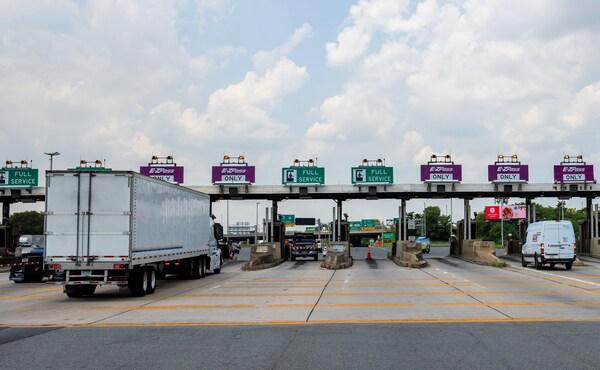 Truck at toll plaza using PrePass Tolls with GPS toll verification.