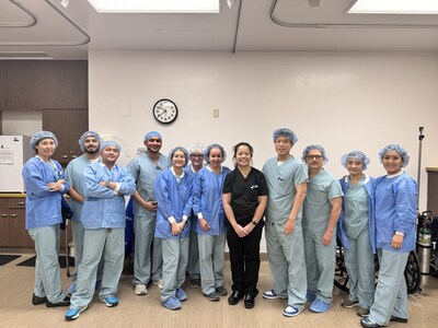 Nani Gelvezon (center, black scrubs), DO, General Surgeon, Adventist Health White Memorial Montebello, with the Surgery team. Dr. Gelvezon completed the hospital’s 100th robotic surgery procedure.