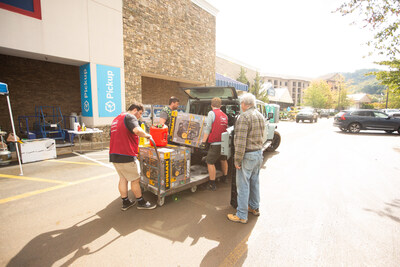 Lowe's associates in Boone, N.C. help a customer load a generator into their car. Pre-staged supplies, like generators, enabled the company to rapidly respond to community needs.